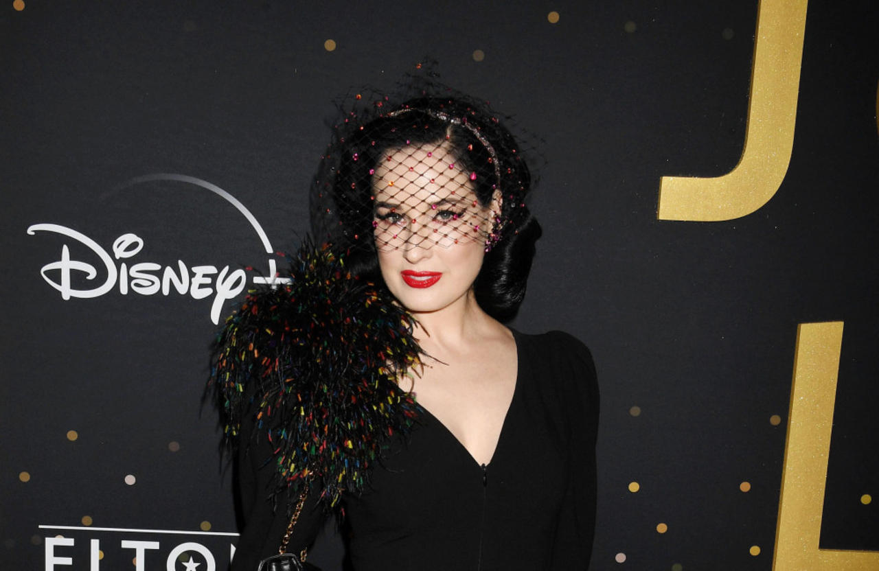 Dita Von Teese has hailed Taylor Swift as 'so smart, professional and funny'