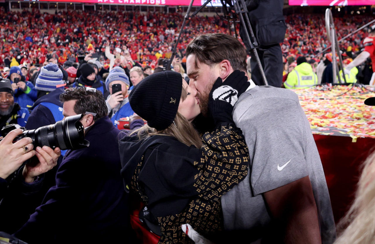 Taylor Swift and Travis Kelce share on-field kiss after Kansas City Chiefs' AFC Championship win