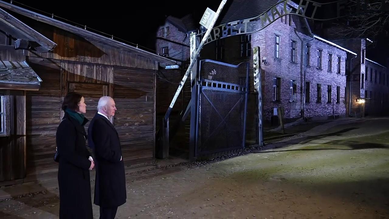 King visits Auschwitz and lays wreath in memory of victims