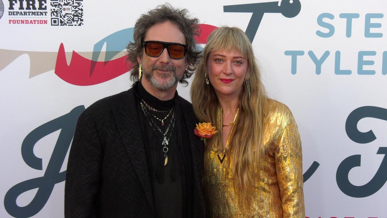 Chris Robinson and Camille Johnson on the red carpet at Steven Tyler’s 6th annual Grammy Awards viewing party