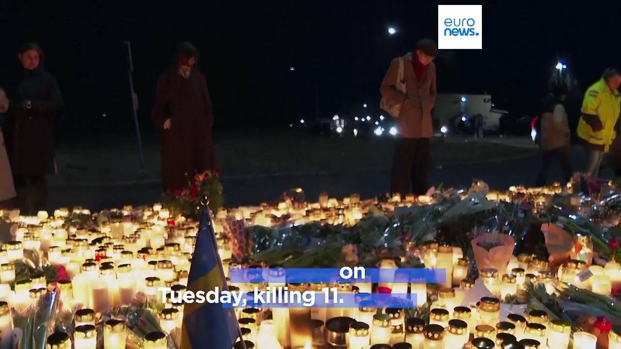 People in Örebro light candles in tribute to victims of Swedish mass shooting