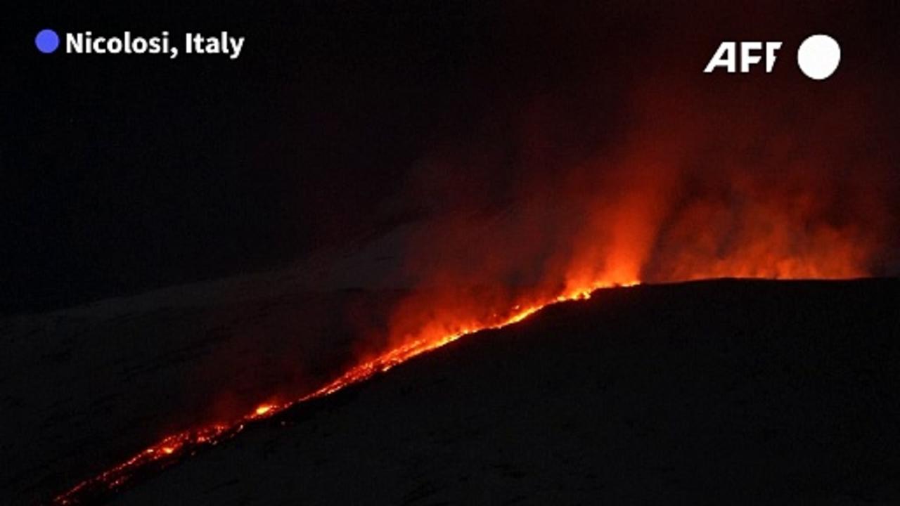 Lava flows from Italy's Mount Etna during night-time eruption