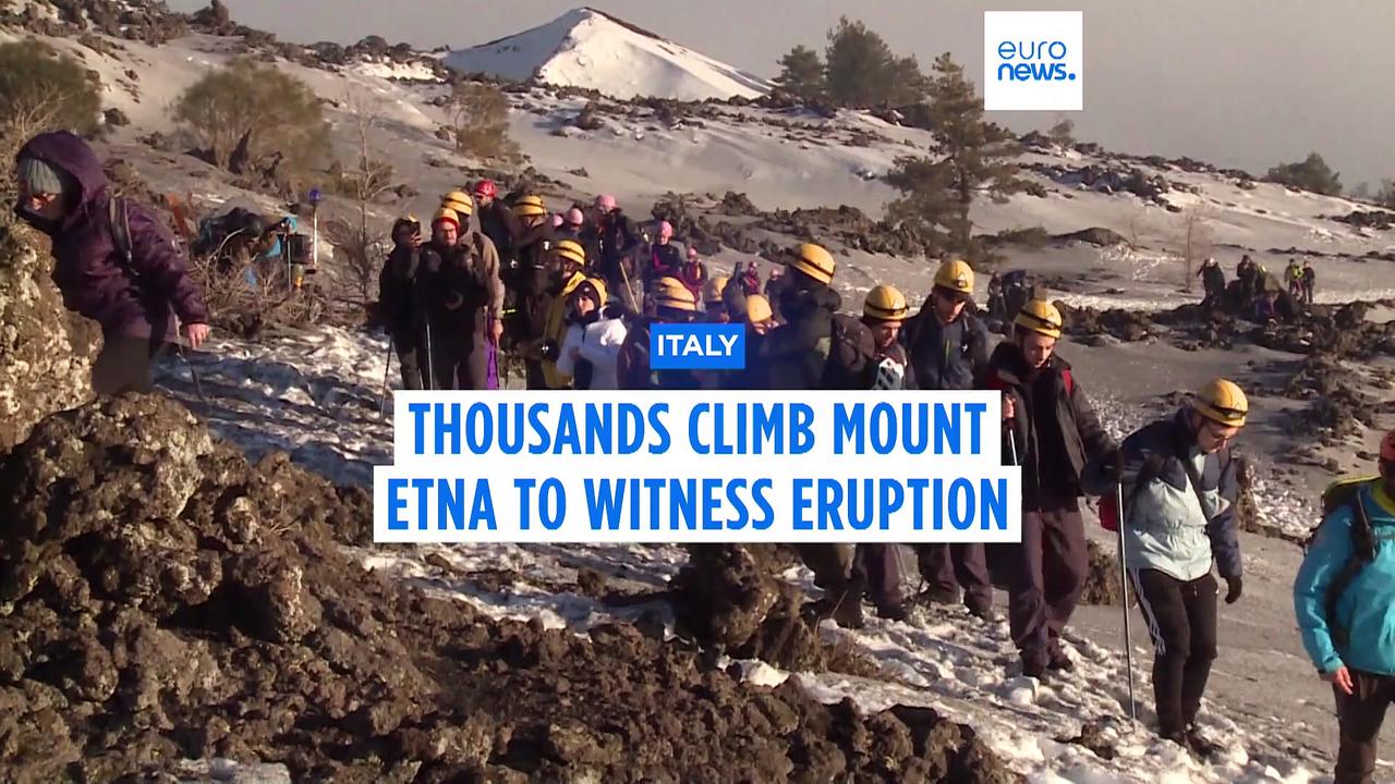 Thousands of hikers climb Sicily's Mount Etna to witness eruption