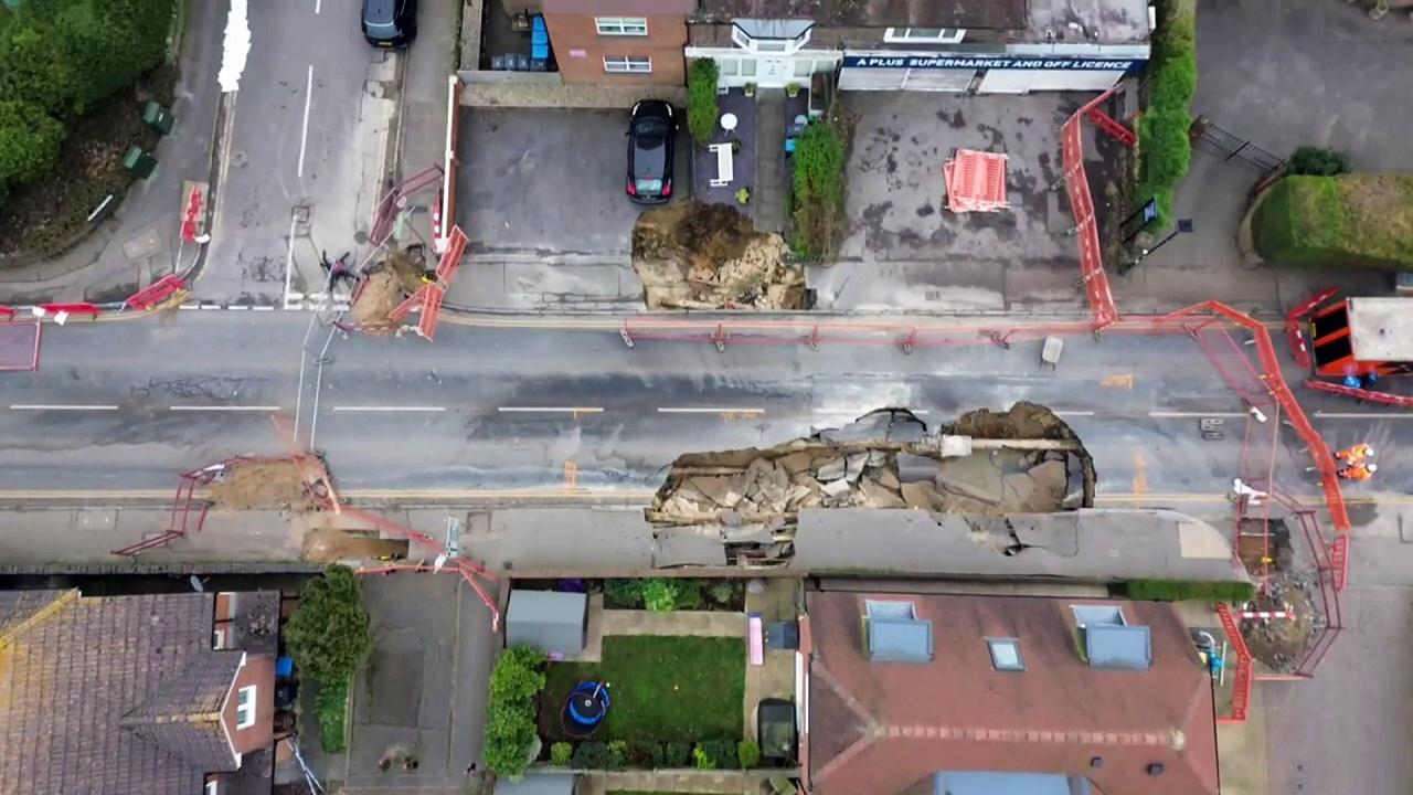 Drone shots of large sinkhole in Surrey main road