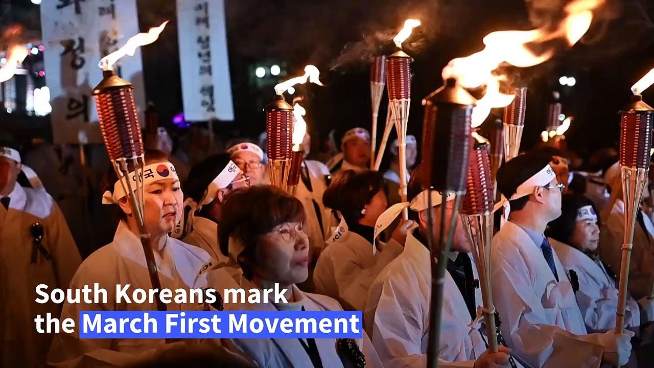 South Koreans march to celebrate March First Movement for independence