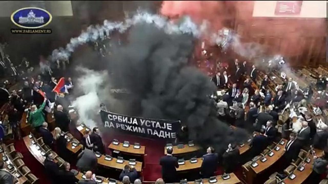 Serbia's opposition disrupts parliament with flares and suspected tear gas