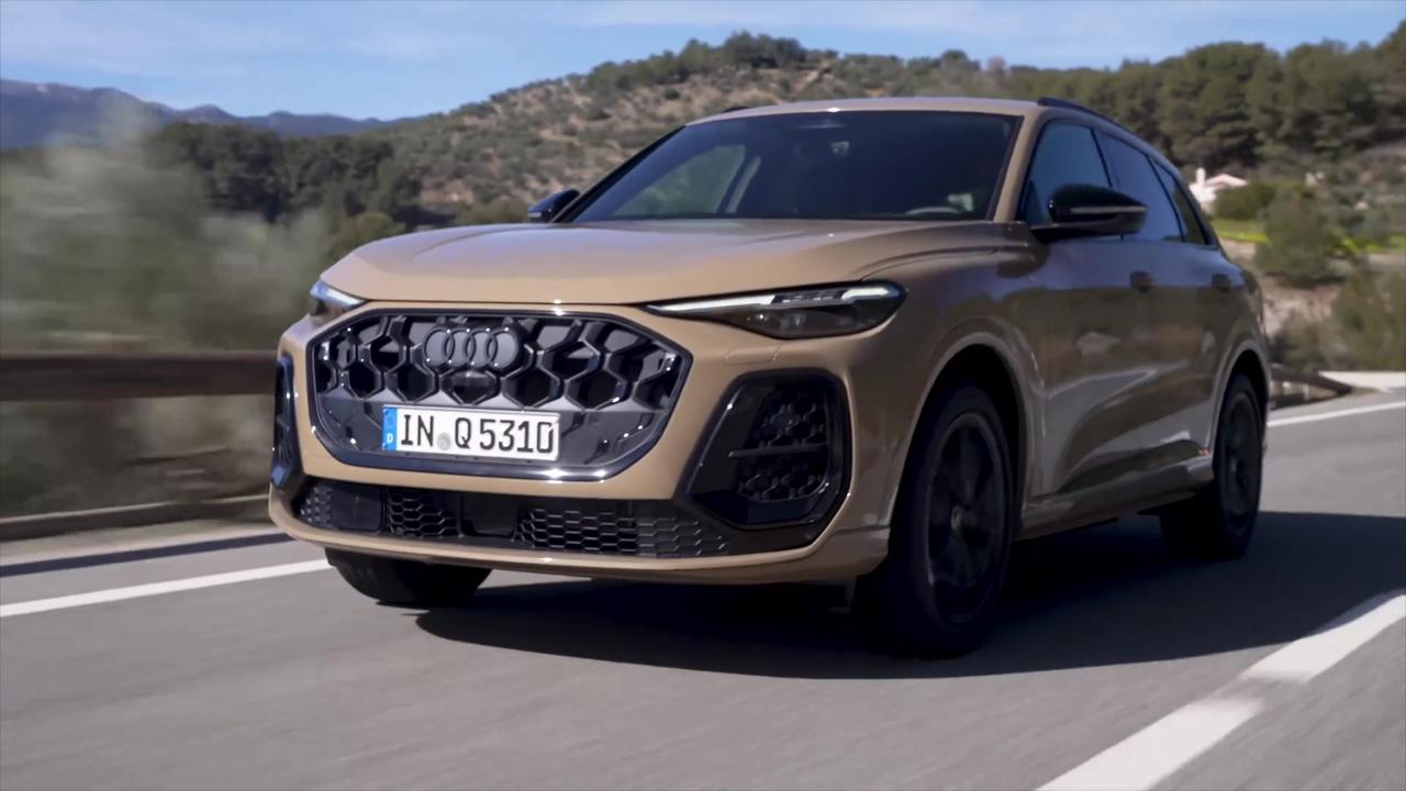 The new Audi Q5 SUV in Sakhir gold metallic Driving Video