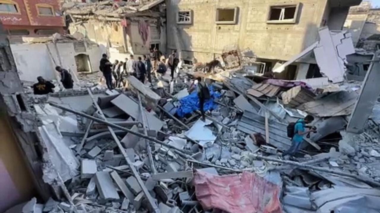 Gazans search for casualties following air strike on Bureij camp
