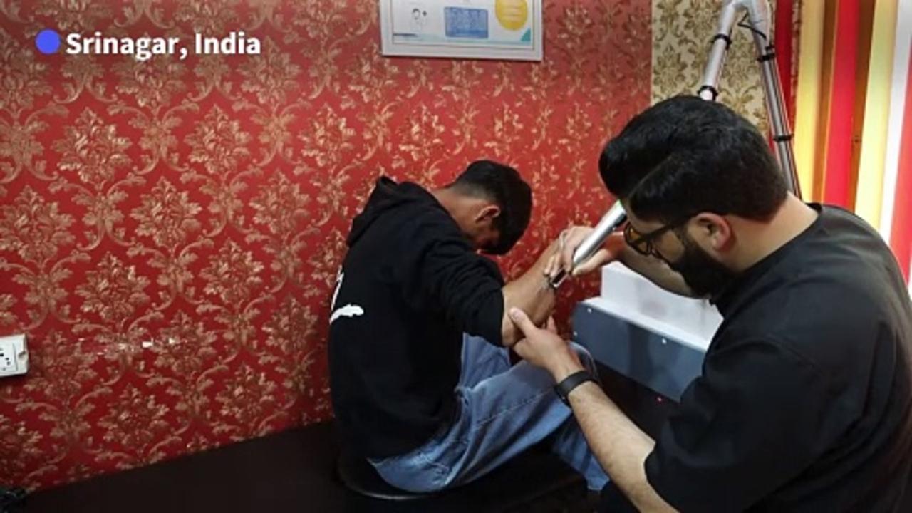 Kashmiris scrub 'resistance tattoos' in fear of Indian police