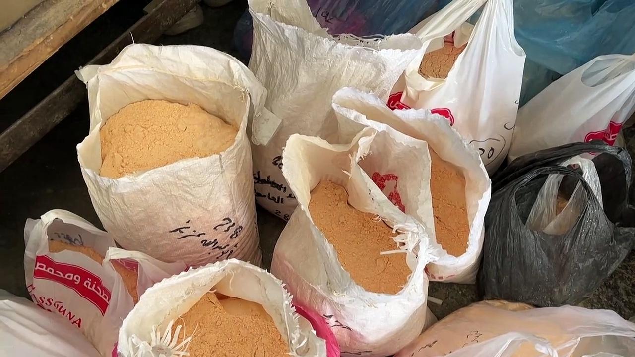 Gazans resort to grinding lentils and pasta for bread baking amid flour shortages