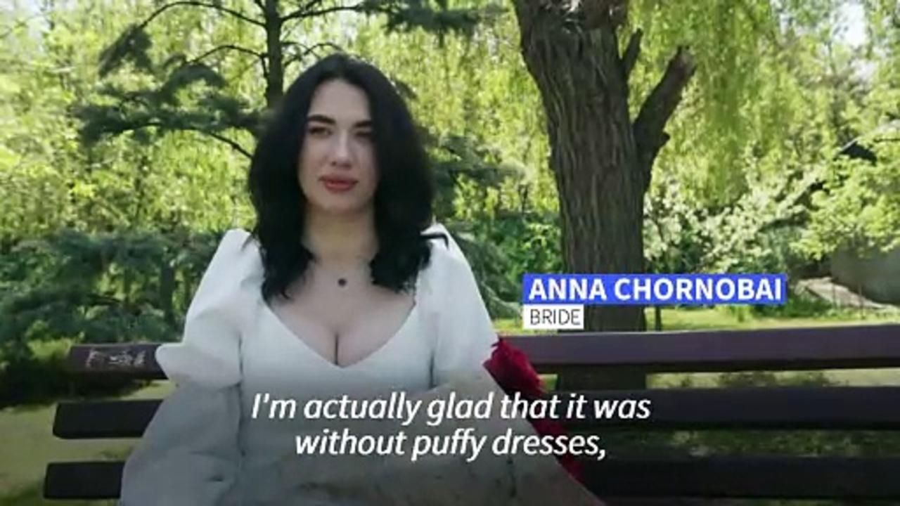 Ukrainian newlyweds tie the knot just miles from the front line
