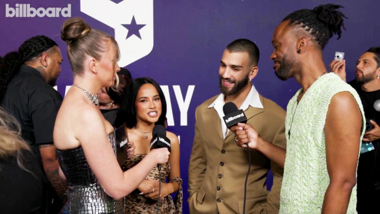 Becky G & Manuel Turizo On Wanting to Party with J.Lo And Gloria Estefan, Their Collab & Music Video Easter Eggs | AMAs 2025