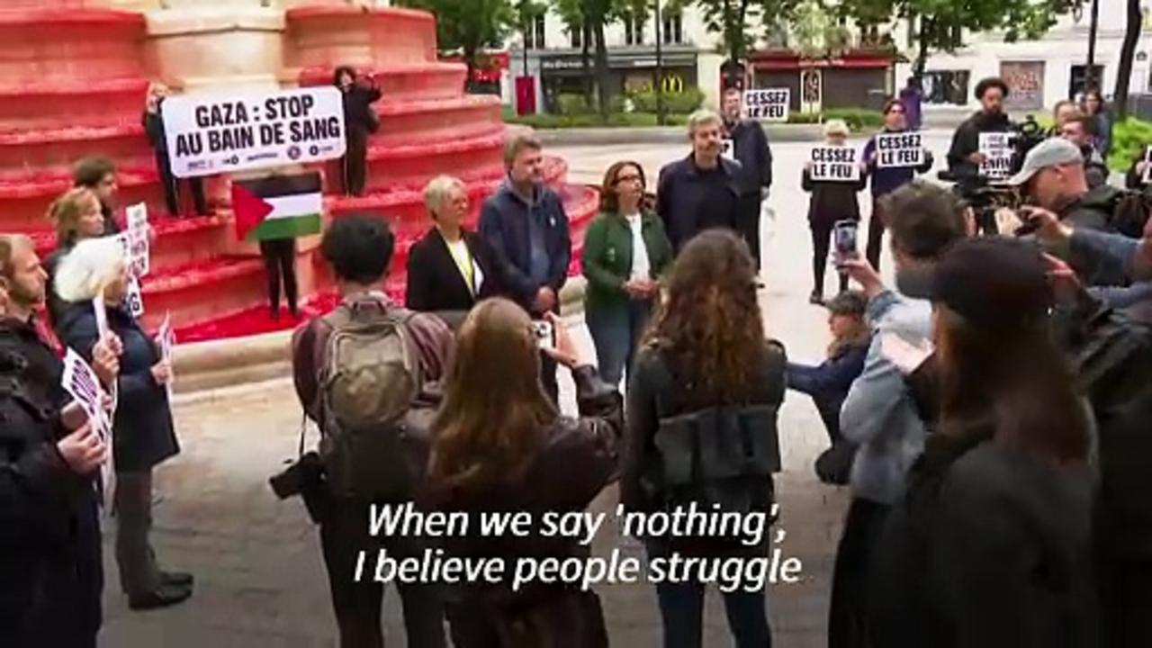 Activists dye Paris fountain red to say 'stop the bloodbath' in Gaza
