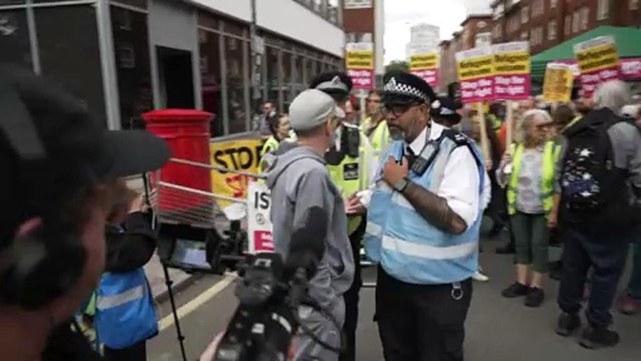 Rival groups standoff as asylum hotel protest starts